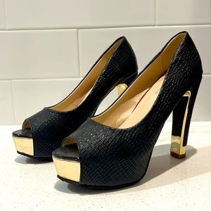 Black pair of textured high heels.